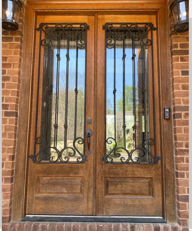 The same double entry door before refinishing, faded from sun exposure
